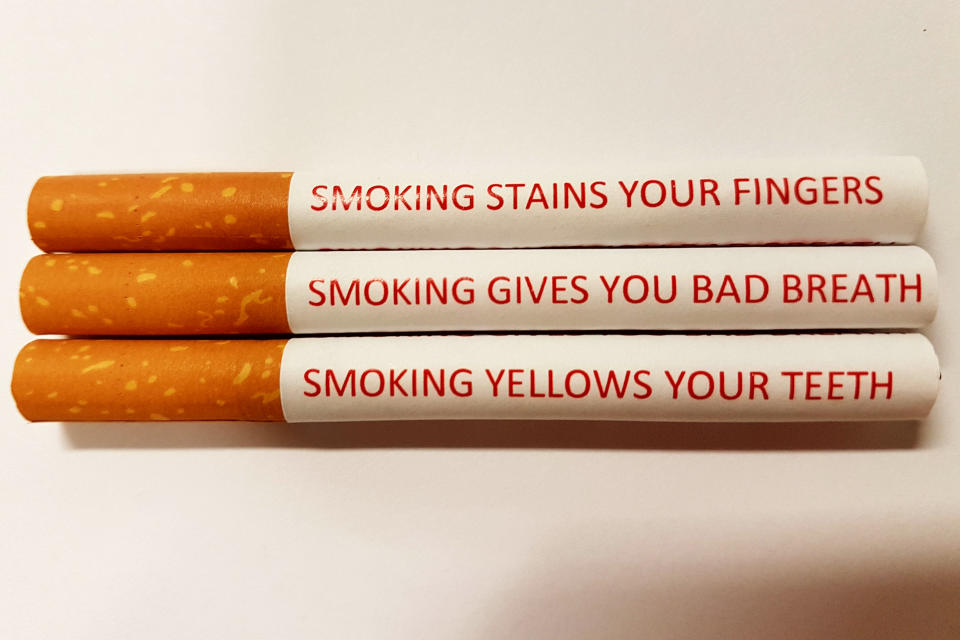 The printing would include things like how many minutes of life smokers will lose as they puff. Source: AAP