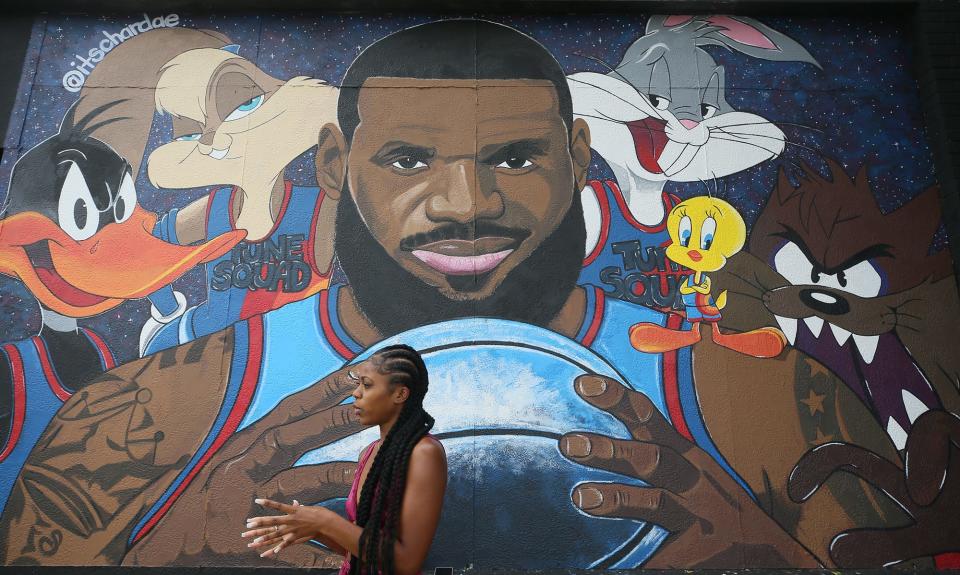 Chardae Slater, 24, a Kent State University art student, talks about painting the LeBron James "Space Jam" mural on West Market and North Valley Street on Wednesday July 21, 2021.