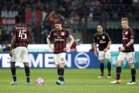 Football Soccer - AC Milan v Juventus - San Siro stadium, Milan, Italy - 9/04/16 - AC Milan's players react. REUTERS/Alessandro Garofalo