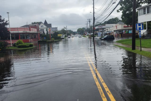 <p>Danbury Fire Department/Facebook</p> Floodwaters in Danbury, Conn,. after tropical downpours on Sunday. Aug. 18, 2024