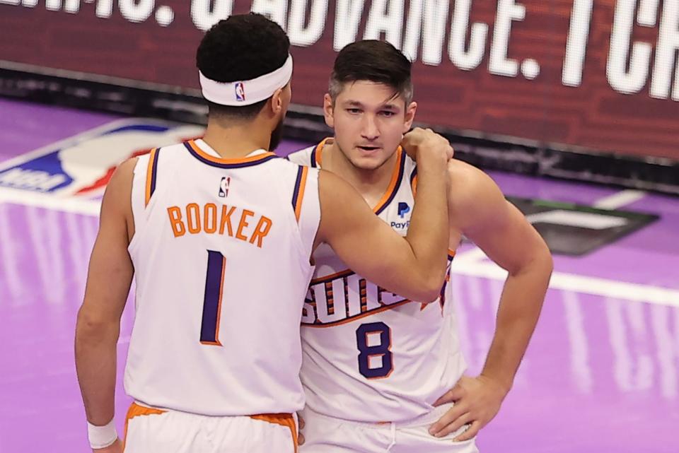 Nov 17, 2023; Salt Lake City, Utah, USA; Phoenix Suns guard Devin Booker (1) and guard Grayson Allen (8) speak during a break in action against the Utah Jazz in the first quarter at Delta Center.