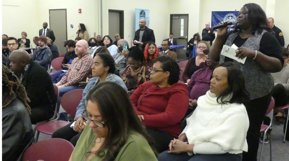 An audience member addresses her question to San Bernardino County public officials and leaders, who were invited to discuss equity issues during a Town Hall meeting at Victor Valley College.