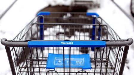 A Walmart shopping cart is seen in their parking lot in Westbury,New York, February 17, 2010. REUTERS/Shannon Stapleton