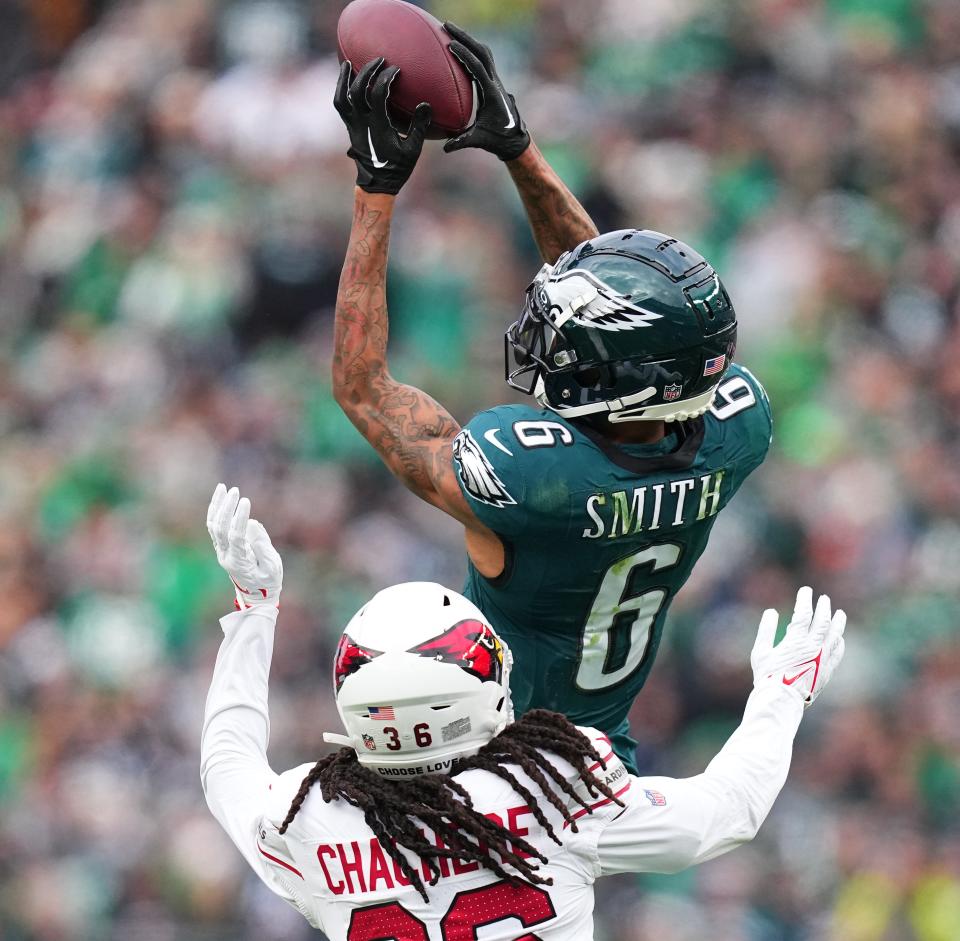PHILADELPHIA, PENNSYLVANIA – DECEMBER 31: DeVonta Smith #6 of the Philadelphia Eagles catches a pas against <a class="link " href="https://sports.yahoo.com/nfl/players/31573" data-i13n="sec:content-canvas;subsec:anchor_text;elm:context_link" data-ylk="slk:Andre Chachere;sec:content-canvas;subsec:anchor_text;elm:context_link;itc:0">Andre Chachere</a> #36 of the <a class="link " href="https://sports.yahoo.com/nfl/teams/arizona/" data-i13n="sec:content-canvas;subsec:anchor_text;elm:context_link" data-ylk="slk:Arizona Cardinals;sec:content-canvas;subsec:anchor_text;elm:context_link;itc:0">Arizona Cardinals</a> during the second quarter at Lincoln Financial Field on December 31, 2023 in Philadelphia, Pennsylvania. (Photo by Mitchell Leff/Getty Images)