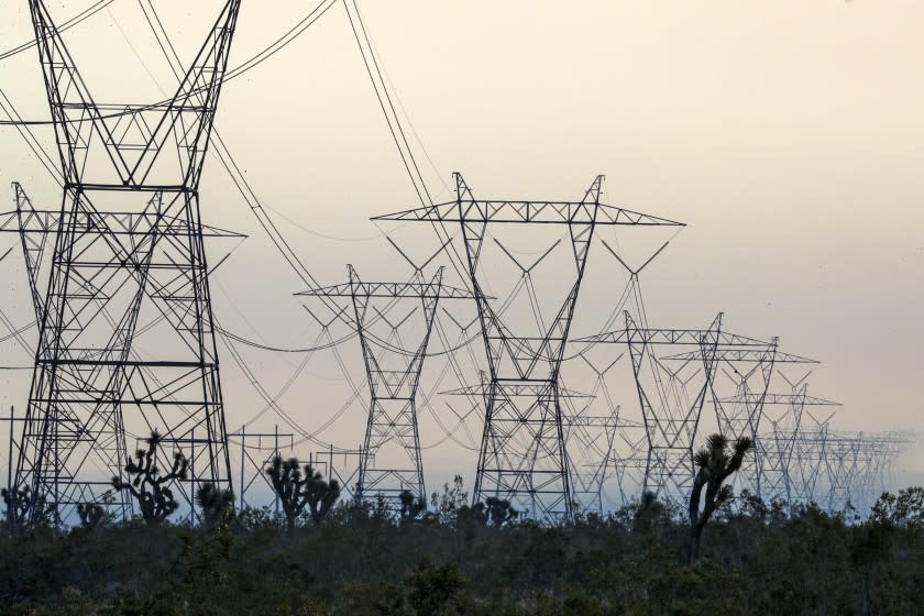 LITTLE ROCK, CA - SEPTEMBER 18: Power lines against smoke from Bobcat fire rageing in Juniper Hills. Wild fire that has now chewed through more than 60,000 acres, has burned through the Angeles National Forest has reached Foothills of the Antelope Valley in three different locations burning near Devil's Punchbowl nature area , the second is advancing toward Tumbleweed Road from Cruthers Creek, and the third has jumped Juniper Hills Road at Longview Road Juniper Hills on Friday, Sept. 18, 2020 in Little Rock, CA. (Irfan Khan / Los Angeles Times)