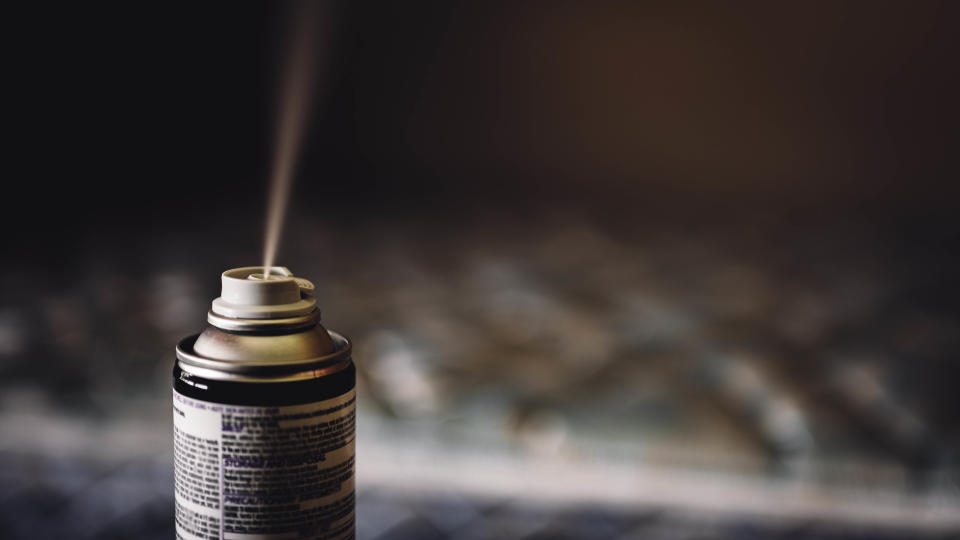 A fogger being used to repel spiders