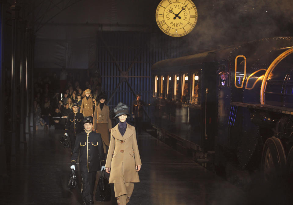 Models wear creations by U.S fashion designer Marc Jacobs for his Louis Vuitton collection, Women's Fall-Winter, ready-to-wear 2013 during Paris Fashion week, Wednesday, March 7, 2012. (AP Photo/Jacques Brinon)