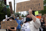 WASHINGTON, DC - JUNE 02: (EDITOR'S NOTE: Image contains profanity.) Demonstrators stage a protest near the Saint John Paul II National Shrine, where President Donald Trump planned a visit, in response to the death of George Floyd while under police custody June 2, 2020 in Washington, DC. President Trump laid a ceremonial wreath and observed a moment of silence to the statue of Saint John Paul II during his visit at the shrine. (Photo by Alex Wong/Getty Images)