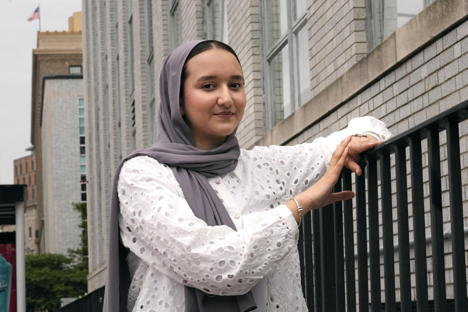 Northeastern University student Mashal Aziz poses on campus, Friday, July 21, 2023, in Boston. Aziz was just months away from graduating from college in Afghanistan when she found herself rushing to the airport to leave the country as the Taliban swept into power. Universities and colleges across the U.S. have scrambled to find ways to help students, like Aziz, to continue their education. (AP Photo/Charles Krupa)