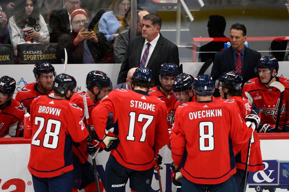 Capitals head coach Peter Laviolette, top center, with assistant coach and New Bedford native Scott Allen, top right.