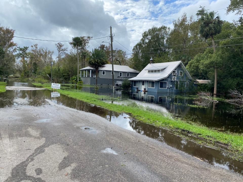 Some streets and homes are flooded in Astor after Tropical Storm Nicole blew through on Thursday.