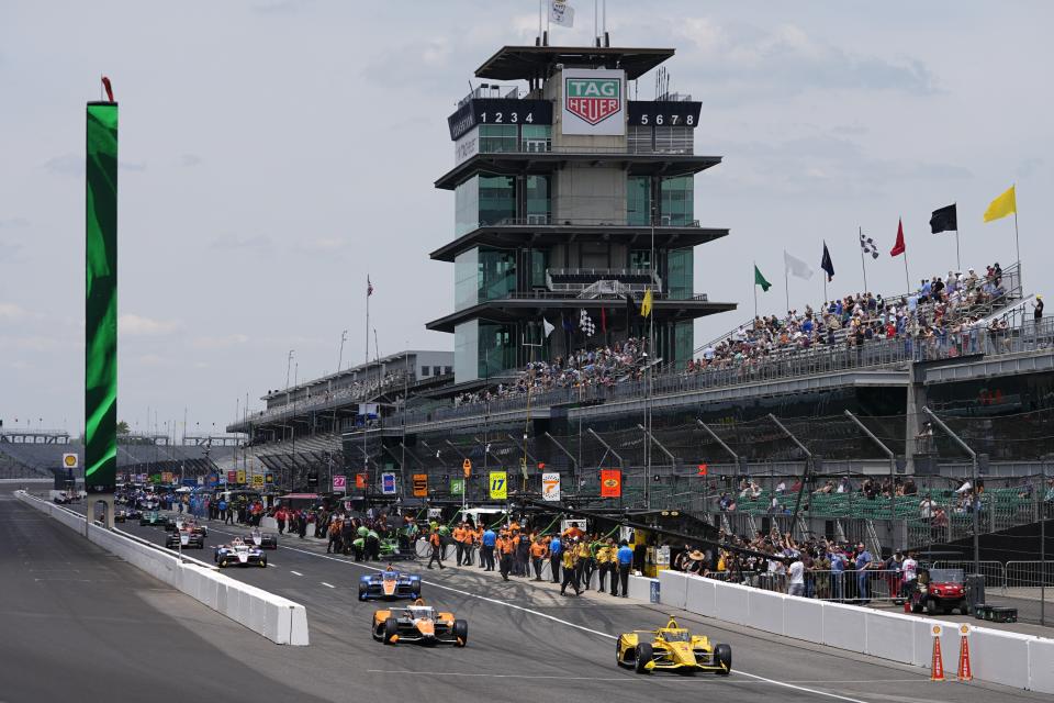 Scott McLaughlin, of New Zealand, leads a group of cars onto the track during a practice session for the Indianapolis 500 auto race at Indianapolis Motor Speedway, Monday, May 20, 2024, in Indianapolis. (AP Photo/Darron Cummings)