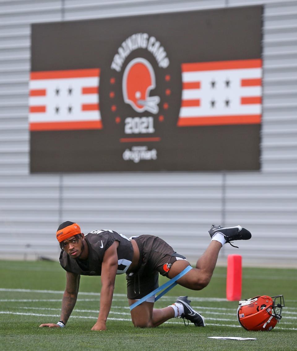 Cleveland Browns cornerback Greg Newsome II stretches during NFL football training camp, Saturday, July 31, 2021, in Berea, Ohio.
