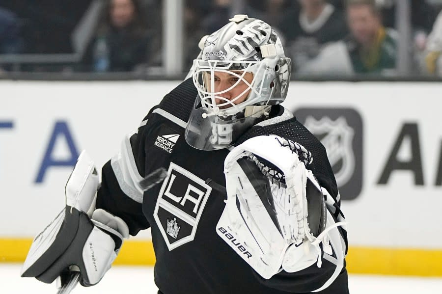 Los Angeles Kings goaltender Cam Talbot makes a glove save during the first period of an NHL hockey game against the Colorado Avalanche Wednesday, Oct. 11, 2023, in Los Angeles. (AP Photo/Mark J. Terrill)