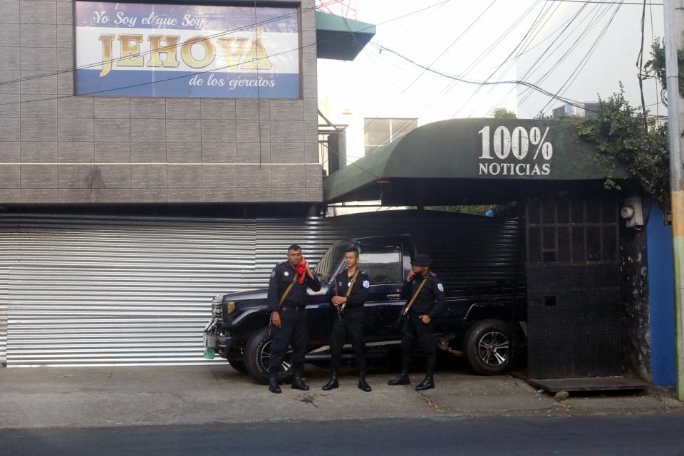 Police guard a building