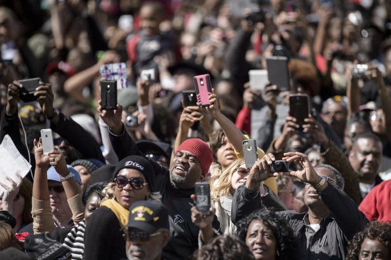 People take photos at the Edmund Pettus Bridge on March 7, 2015 in Selma, Alabama