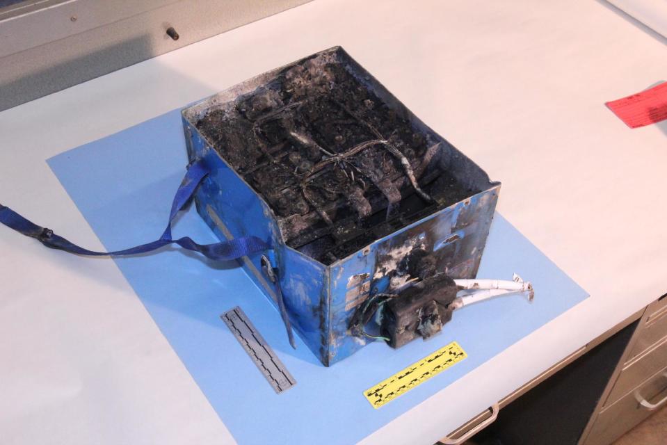This undated image provided by the National Transportation Safety Board shows the burned auxiliary power unit battery from a JAL Boeing 787 that caught fire on Jan. 7, 2013, at Boston's Logan International Airport. Federal officials said on Wednesday, Jan. 16, 2013, that they are temporarily grounding Boeing's 787 Dreamliners until the risk of possible battery fires is addressed. (AP Photo/National Transportation Safety Board)