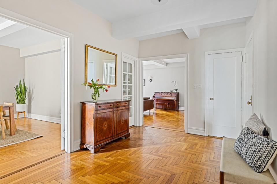 The co-op comes with classic details, such as handsome herringbone floors. Allyson Lubow