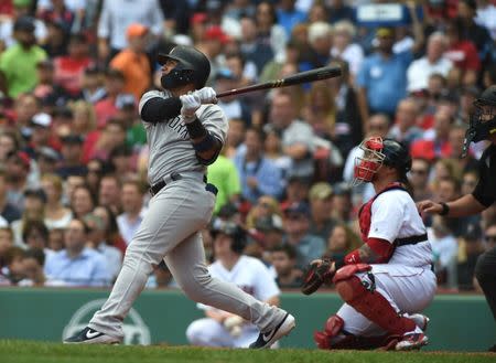 Sep 29, 2018; Boston, MA, USA; New York Yankees second baseman Gleyber Torres (25) hits a two run home run during the fourth inning against the Boston Red Sox at Fenway Park. Bob DeChiara-USA TODAY Sports