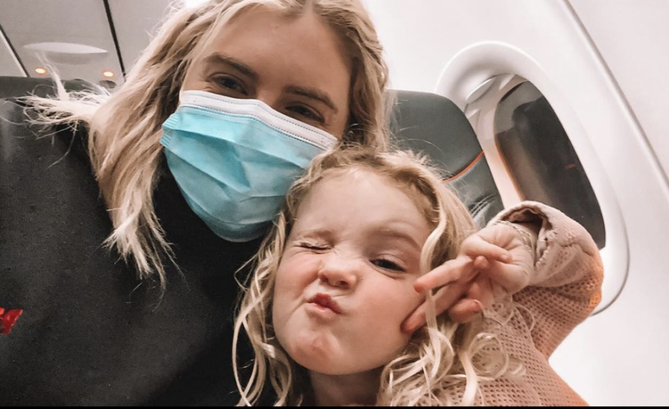 Megan Dalbeth and her daughter Hailey on an aeroplane. 