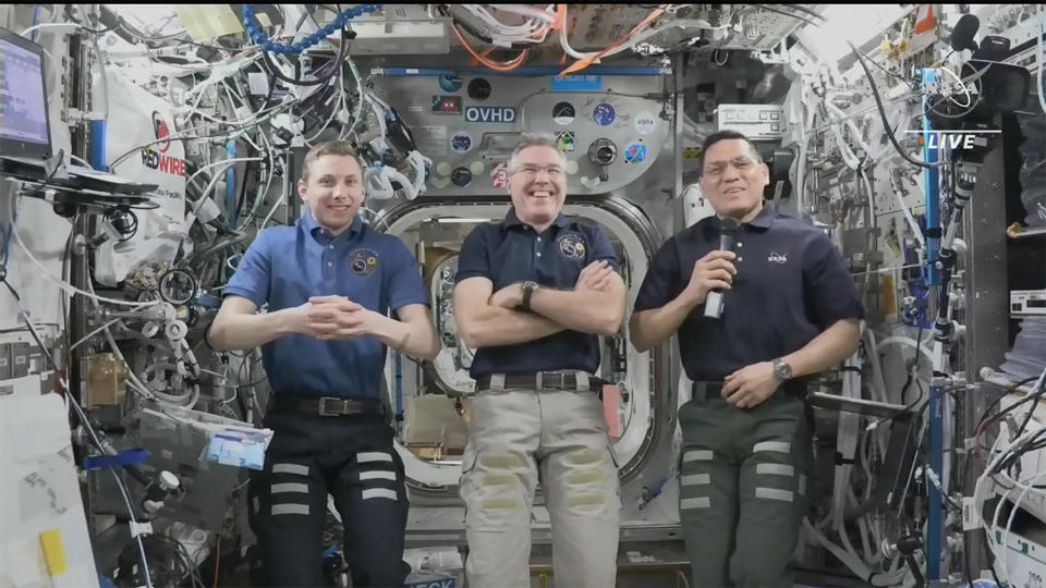 NASA astronauts Woody Hoburg (left), Stephen Bowen (center) and Frank Rubio (right) answer questions about life in orbit while hosting four visiting 