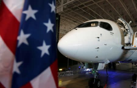 FILE PHOTO: A Bombardier CS100 aircraft sits in their hangar after a news conference announcing a contract with Delta Air Lines, in Mirabel, Quebec, Canada April 28, 2016. REUTERS/Christinne Muschi/File Photo