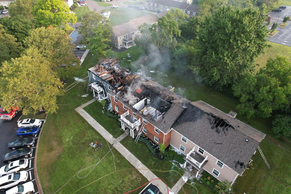 Flames could be seen from the roof of an apartment fire in Washington Township early Thursday morning.