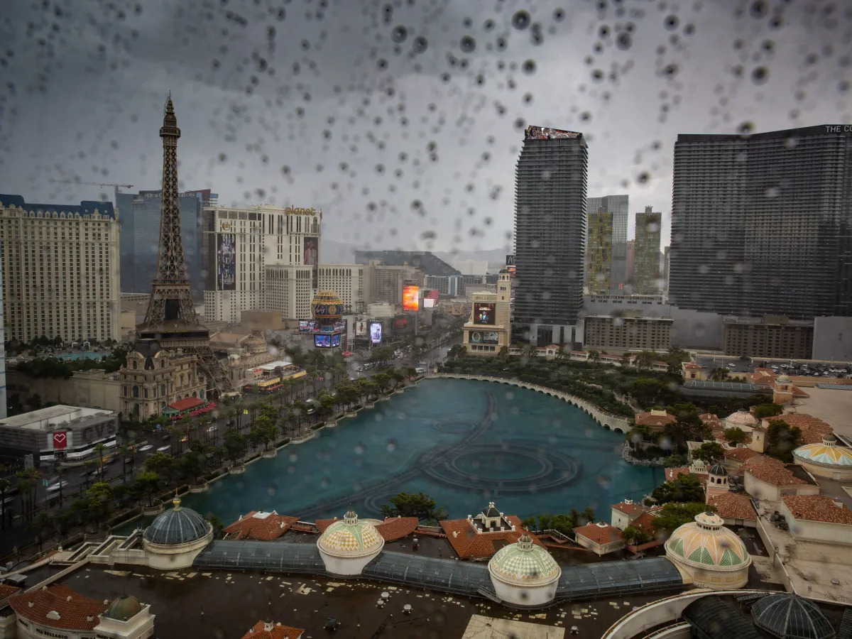 Videos show water pouring into casinos and flooding parts of Las Vegas as a rare..