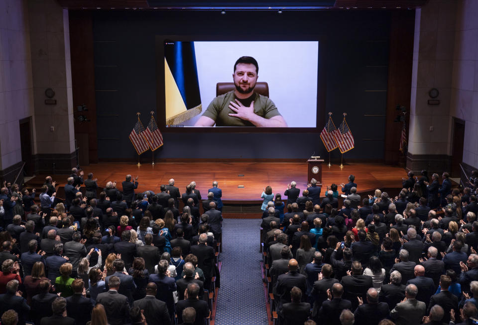 Ukrainian President Volodymyr Zelenskyy speaks to the U.S. Congress by video to plead for support as his country is besieged by Russian forces, at the Capitol in Washington, Wednesday, March 16, 2022. (AP Photo/J. Scott Applewhite, Pool)
