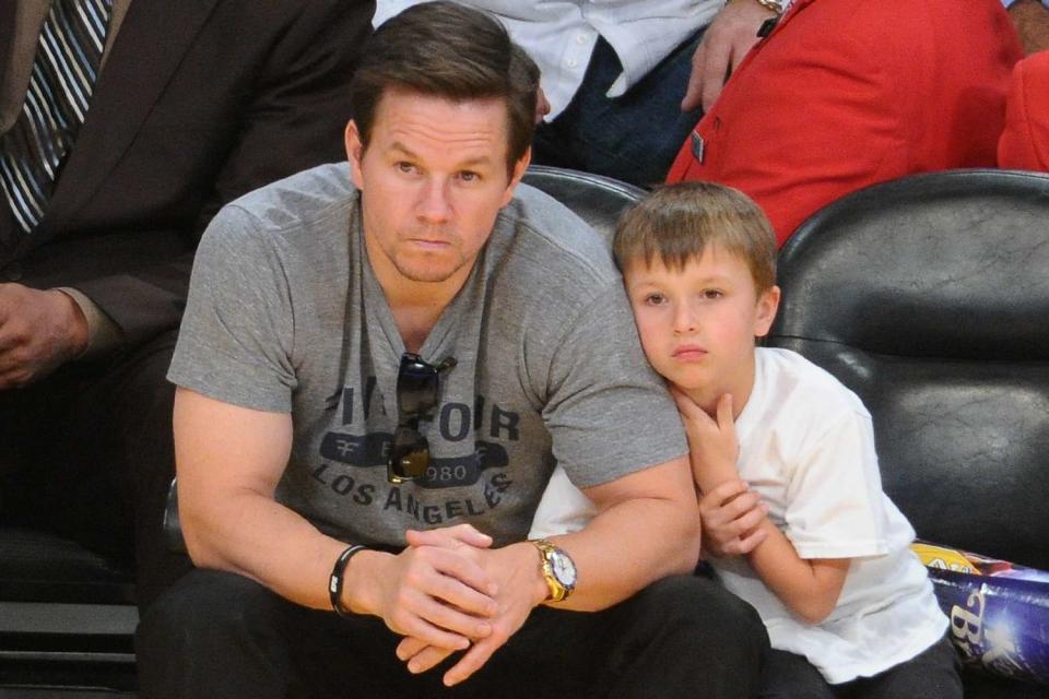 <p>Noel Vasquez/Getty Images</p> Mark Wahlberg and son Michael during a basketball game between the Miami Heat and the Los Angeles Lakers at Staples Center on January  17, 2013 in Los Angeles