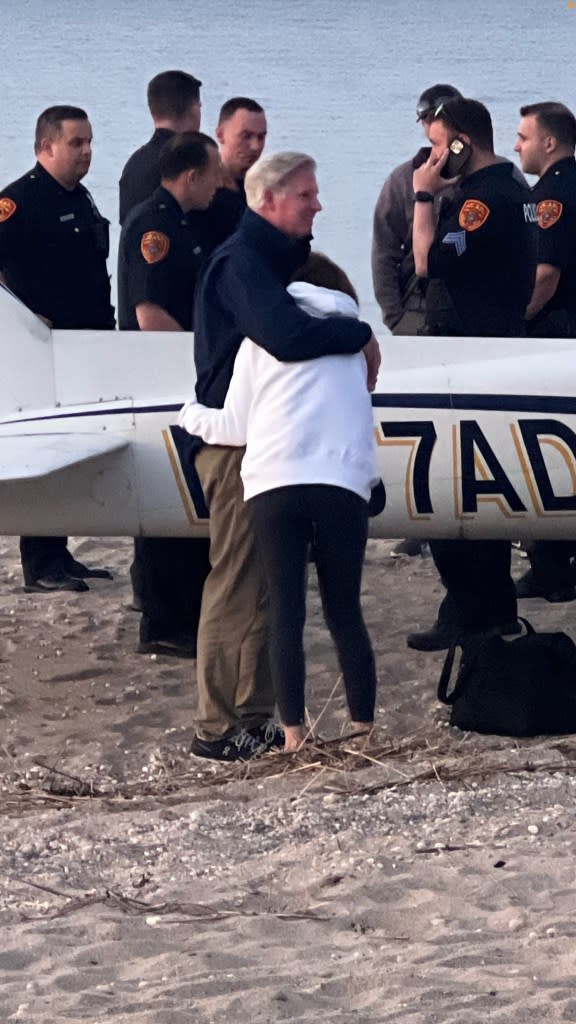 Two people embrace at the scene of the crash Wednesday. Facebook/George Stade