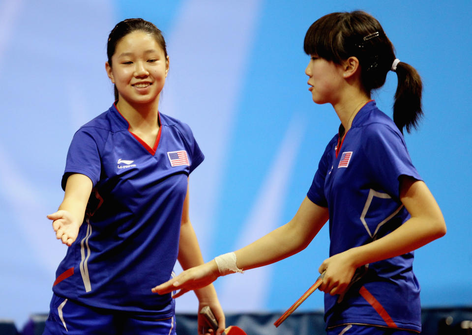 Representing the U.S., Erica Wu (right) and Lily Zhang, both 16 years old, celebrate after their doubles victory during the Women's Table Tennis during Day One of the XVI Pan American Games at Code Dome on October 15, 2011 in Guadalajara, Mexico. (Scott Heavey/Getty Images)