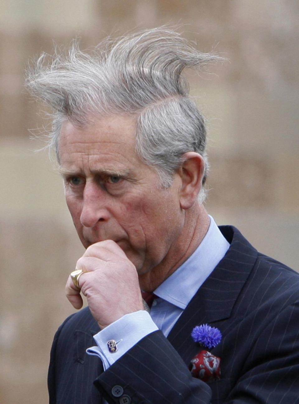 <p>Even royals have bad hair days. Prince Charles walks to a garden party during a visit to Northern Ireland. </p>