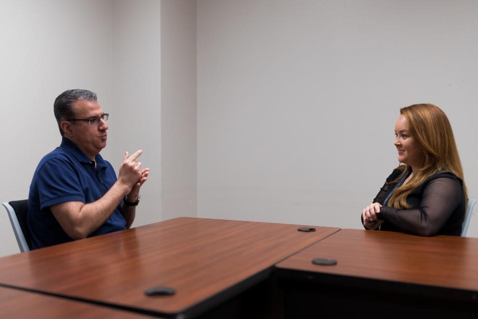 Senior Planner for the city of El Paso Andrew Salloum and Tamara Gastelum, the owner of El Paso SLI Sign Language Interpreters, sign to each other April 14. Gastelum is planning a picnic gathering for deaf people.