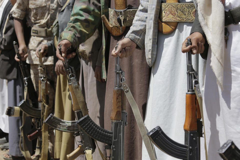 Shiite Houthi tribesmen hold their weapons during a tribal gathering showing support for the Houthi movement, in Sanaa, Yemen, Saturday Sept. 21, 2019. Yemen's Houthi rebels said late Friday night that they were halting drone and missile attacks against Saudi Arabia, one week after they claimed responsibility for a strike that crippled a key oil facility in the kingdom. (AP Photo/Hani Mohammed)
