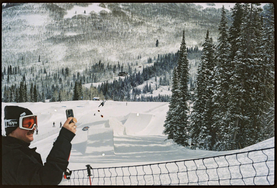 Curt filming action on the rail while a skier hits a lower feature.<p>Photo: Ella Boyd</p>