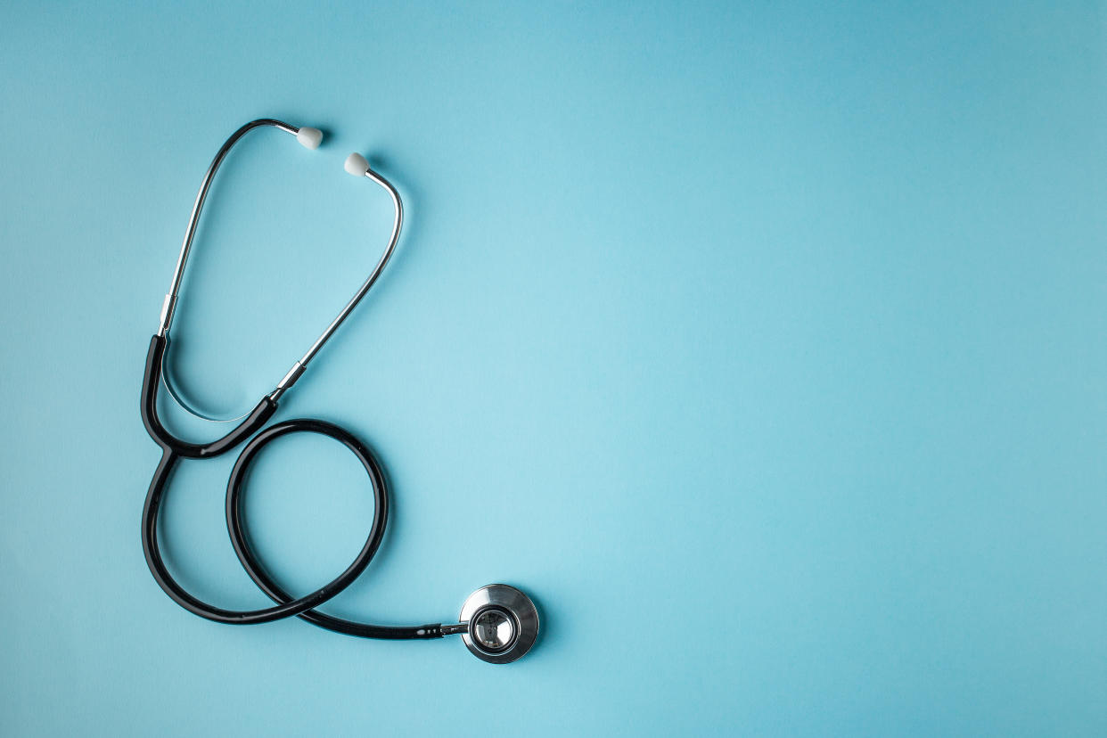 stethoscope against a blue background