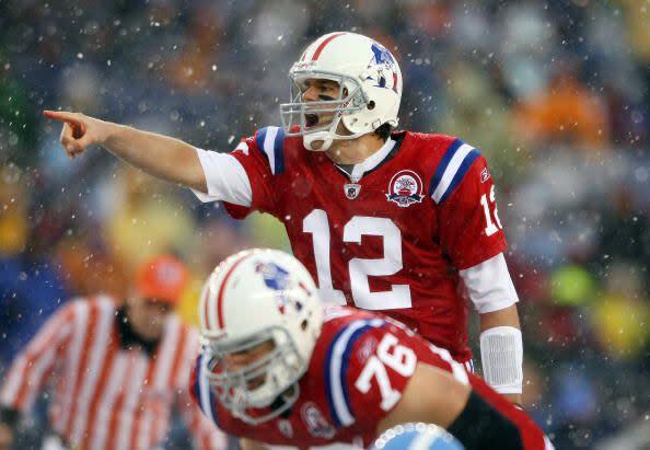 2009:  Quarterback Tom Brady #12 of the New England Patriots calls out the play as Sebastian Vollmer #76 listens in the first quarter against the Tennessee Titans on October 18, 2009 at Gillette Stadium in Foxboro, Massachusetts.  (Photo by Elsa/Getty Images)