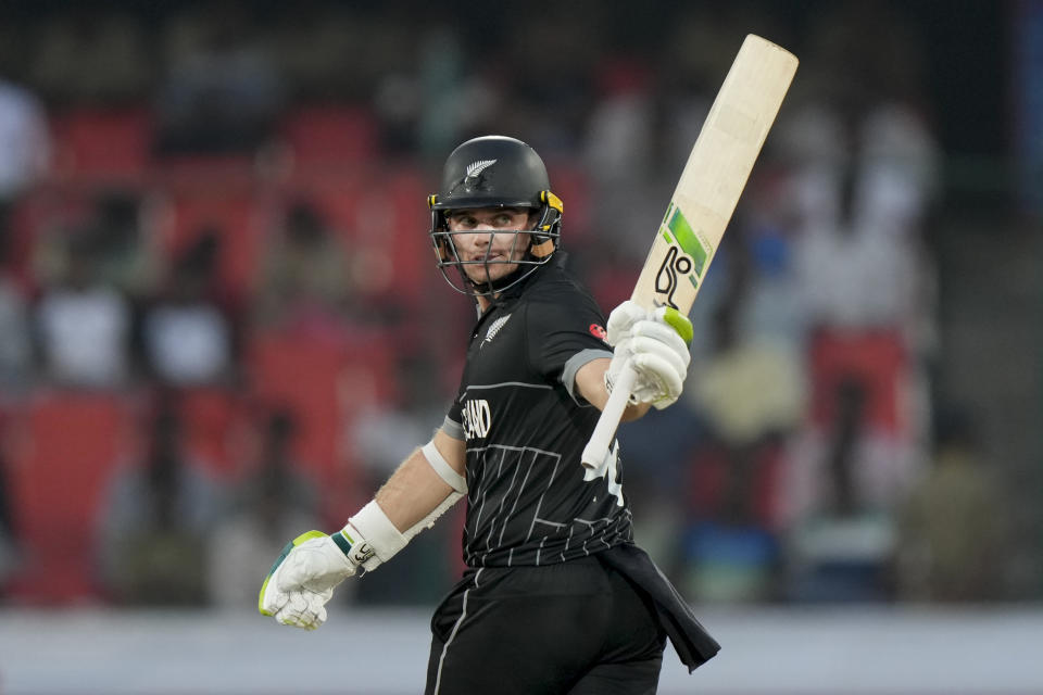 New Zealand's Tom Latham celebrates his fifty runs during the ICC Men's Cricket World Cup match between New Zealand and Netherlands in Hyderabad, India, Monday, Oct. 9, 2023. (AP Photo/Mahesh Kumar A.)