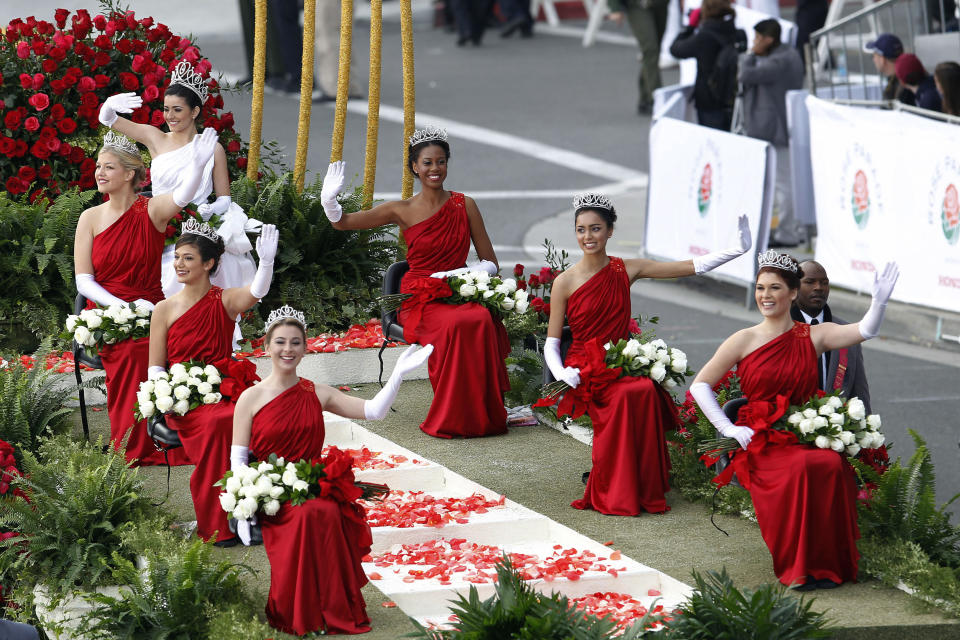 The 2013 Rose Queen and Court ride a float in the 124th Rose Parade in Pasadena, Calif., Tuesday, Jan. 1, 2013. Queen Vanessa Manjarrez, top center, appears with princesses, clockwise from top right, Nicole Nelam, Sonia Shenoi, Madison Teodo, Victoria MacGregor, Tracy Cuesta and Kate Benuska. (AP Photo/Patrick T. Fallon)