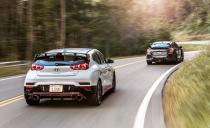 <p>Two hot hatchbacks compared, two hot hatches shown. What better angle is there to shoot <a rel="nofollow noopener" href="https://www.caranddriver.com/reviews/honda-civic-type-r-versus-hyundai-veloster-n-hot-hatch-battle" target="_blank" data-ylk="slk:the new Honda Civic Type R and Hyundai Veloster N;elm:context_link;itc:0;sec:content-canvas" class="link ">the new Honda Civic Type R and Hyundai Veloster N</a> than from the rear? Both high-powered hatchbacks sport huge exhaust outlets (the Civic has three to the Veloster's two), tall wings, and plenty of real (and fake) vents. </p>