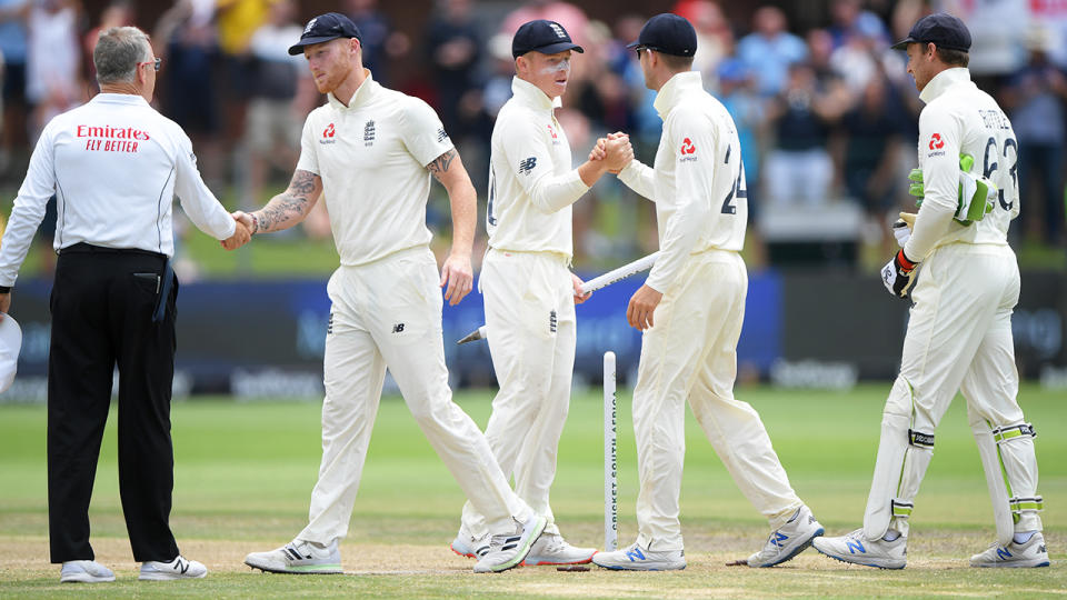 England players, pictured here shaking hands during a Test match.