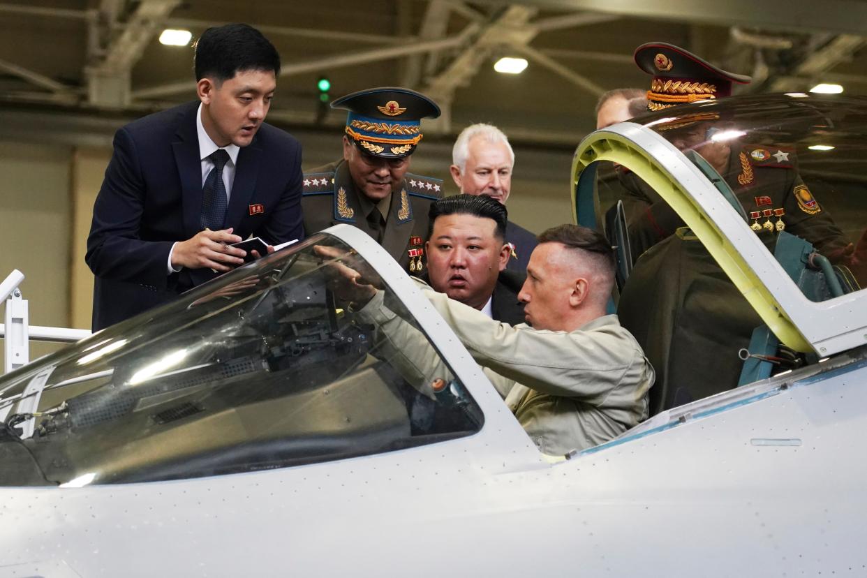 Kim Jong Un looks at a military jet cockpit while visiting a Russian aircraft plant that builds fighter jets in Komsomolsk-on-Amur (Khabarovsky Krai Region Government)