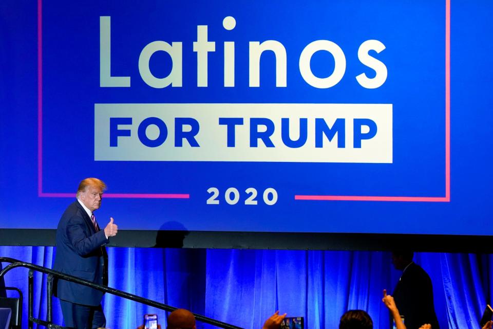 In this Sept. 14, 2020 file photo, President Donald Trump give a thumbs up to the cheering crowd after a Latinos for Trump Coalition roundtable in Phoenix.