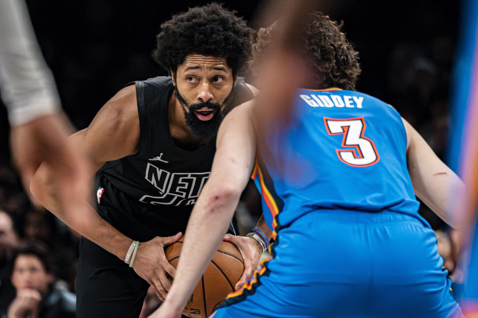 Brooklyn Nets guard Spencer Dinwiddie is defended by Oklahoma City Thunder guard Josh Giddey (3) during the second half of an NBA basketball game in New York, Friday, Jan. 5, 2024. (AP Photo/Peter K. Afriyie)