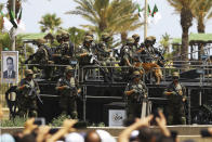 The crowd cheers soldiers during a military parade to mark the 60th anniversary of Algeria's independence, Tuesday, July 5, 2022 in Algiers. Algeria is celebrating 60 years of independence from France with nationwide ceremonies, a pardon of 14,000 prisoners and its first military parade in years. (AP Photo/Anis Belghoul)