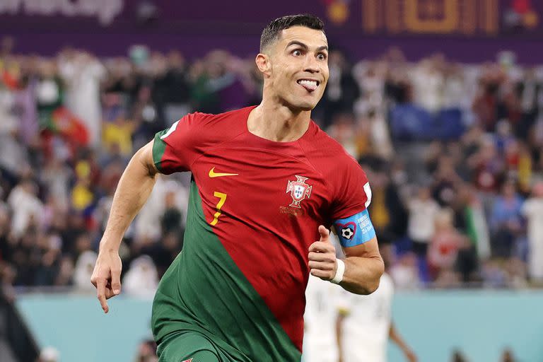 DOHA, QATAR - NOVEMBER 24: Cristiano Ronaldo of Portugal celebrates with Joao Felix after scoring their team's first goal via a penalty during the FIFA World Cup Qatar 2022 Group H match between Portugal and Ghana at Stadium 974 on November 24, 2022 in Doha, Qatar. (Photo by Clive Brunskill/Getty Images)