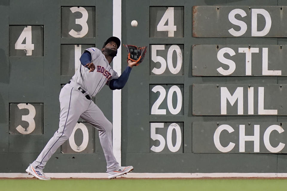 Houston Astros left fielder Yordan Alvarez catches a fly by Boston Red Sox's Justin Turner in the second inning of a baseball game, Monday, Aug. 28, 2023, in Boston. (AP Photo/Steven Senne)