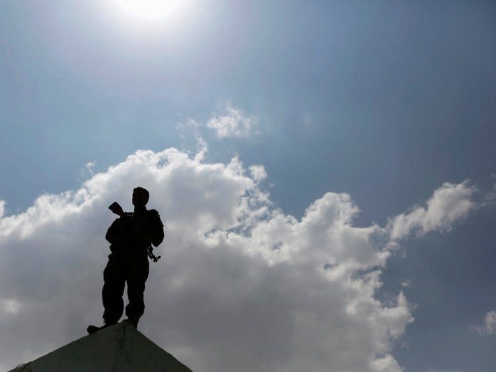 A Houthi militant stands on a wall in Sanaa, Yemen September 5, 2016. REUTERS/Khaled Abdullah