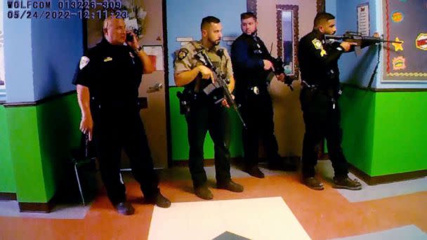 PHOTO: Police deploy in a hallway after Salvador Ramos entered Robb Elementary school in Uvalde, Texas, May 24, 2022 in a still image from police body camera video.  (City Of Uvalde Police Department via Reuters)